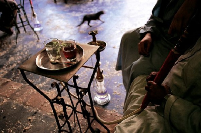 Tea and shisha, a water pipe with flavored tobacco, are standard in Egyptian cafes.  Photograph by Pascal Meunier,