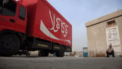 Coke deliver happiness Asian workers in Dubai